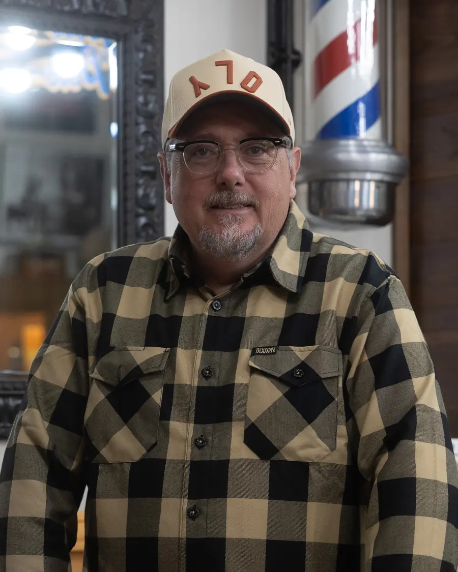 Pete at his chair in the Olympian Barbershop